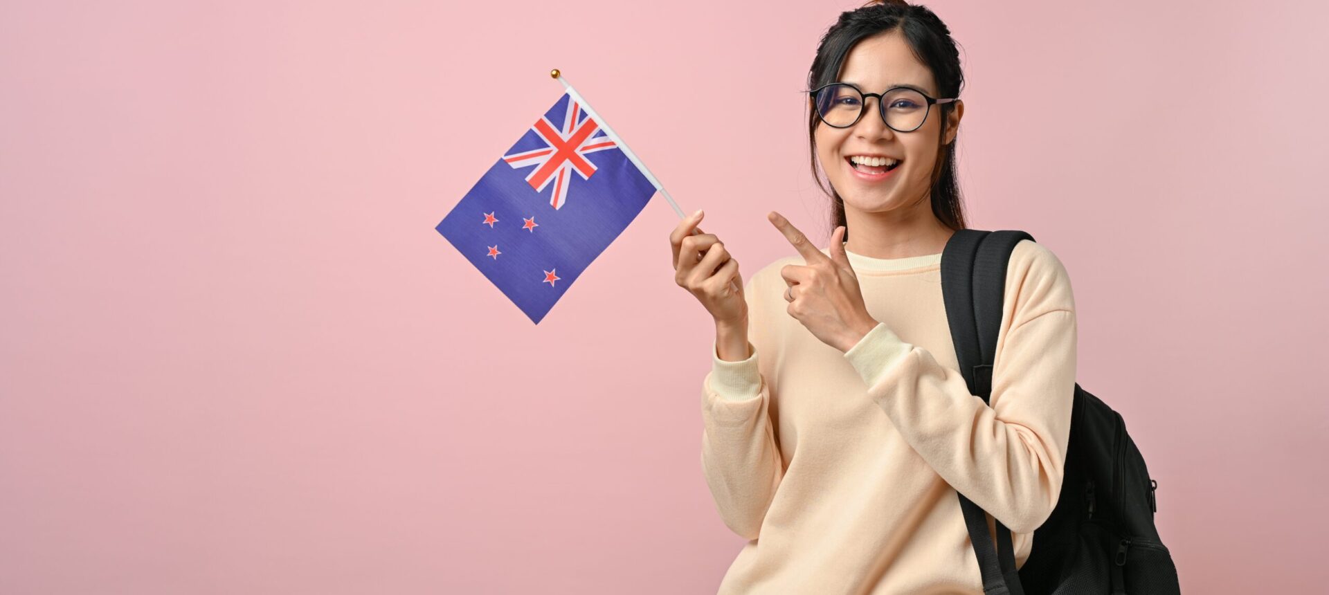 Confident,Pretty,Girl,Showing,A,New,Zealand,Flag,On,Pink