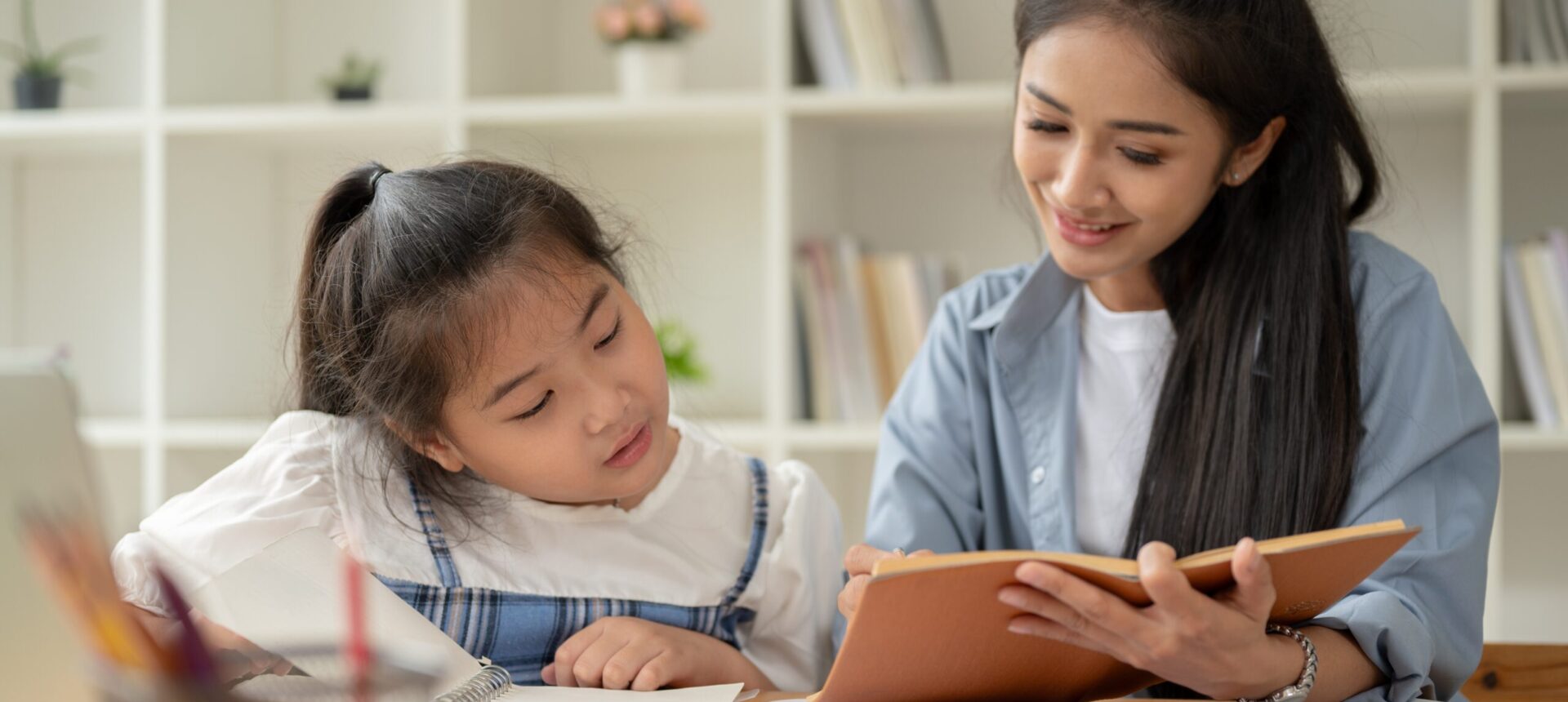 A,Kind,Asian,Mom,Is,Helping,With,Homework,And,Teaching